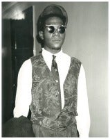 Jean-Michel Basquiat in Wire glasses and Vest
