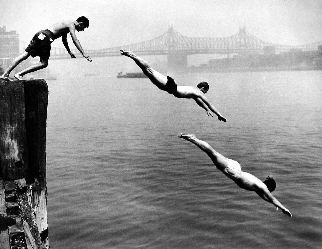 Divers, East River - Photograph by Arthur Leipzig