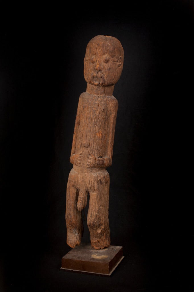 A fine and very ancient Boki Figure from a renowned NY African Art Collection. This wonderful piece has been in the same important collection for over 50 years. 

A stylized standing male figure with arms tight to the body, leaning slightly left,