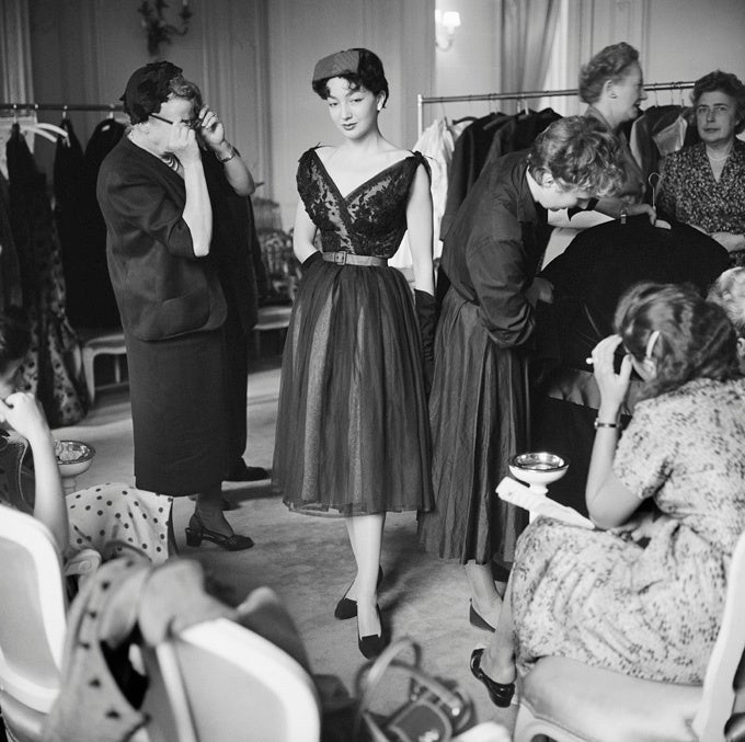 Mark Shaw Black and White Photograph - Dior Model Mauviette in Lace with Buyer