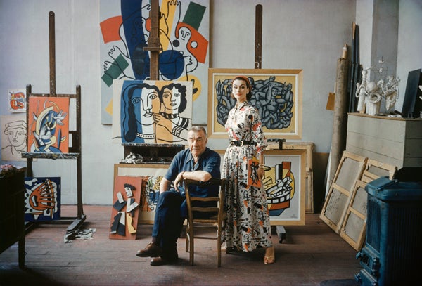 Mark Shaw Color Photograph - Fernand Leger in His Studio With Model Wearing Fabric in the Style of His Work