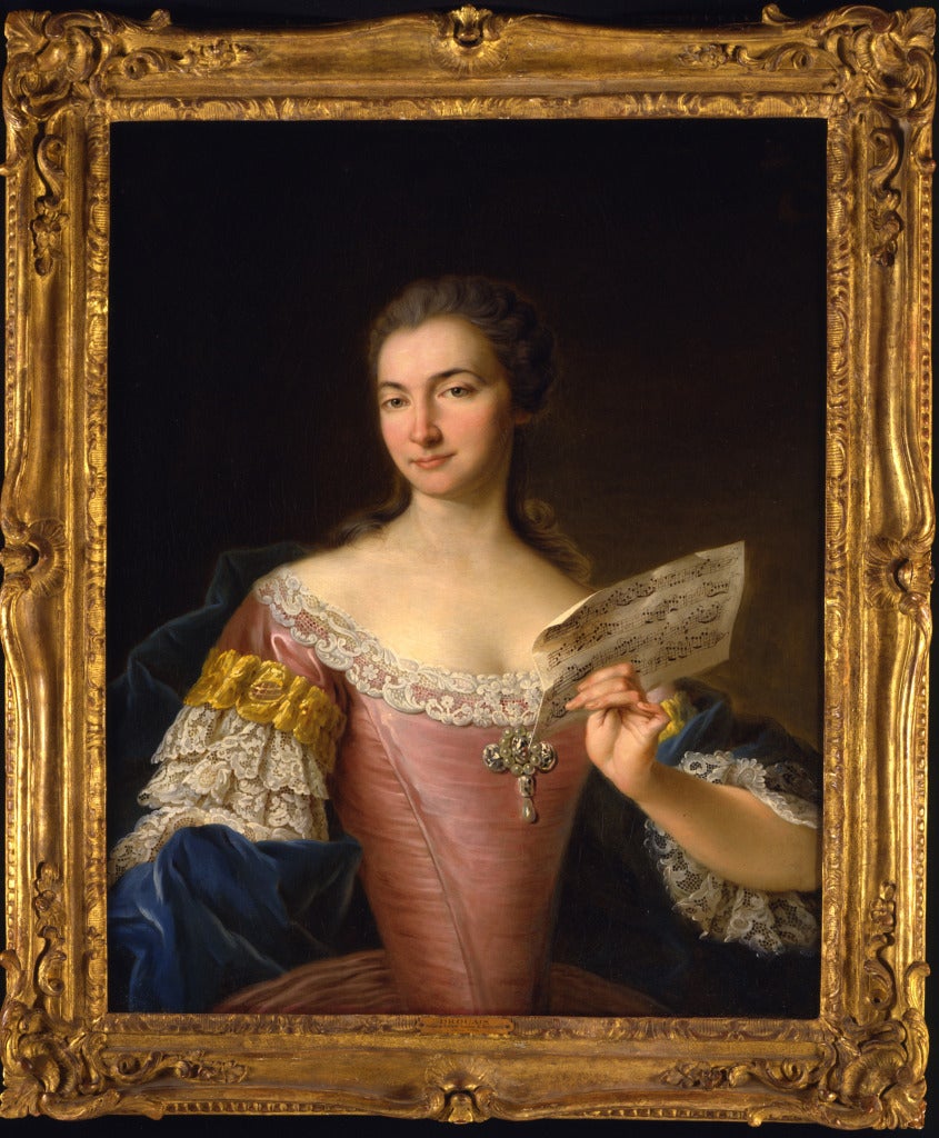 Portrait of a Lady, said to be Sabine, Comtesse de Bassevitz, seated half length, wearing a pink dress with lace trim, holding a - Painting by François Hubert Drouais