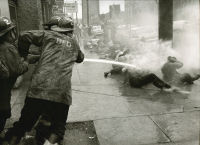 Demonstrators Lie on the Sidewalk While Firemen Hose Them, Birmingham Protests, May 1963
