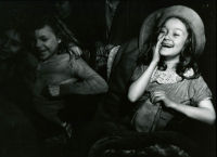 Girl Wearing Hat Laughing in Movie Theater, ca. 1945