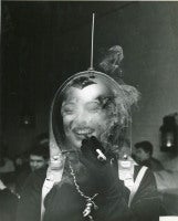 Woman in a Space Helmet Smoking a Cigarette, ca. 1950
