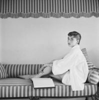 Audrey Hepburn on Striped Sofa , 1954