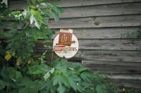 Sign on Country Store with Fallen Porch, near Cypress, Alabama, 1973