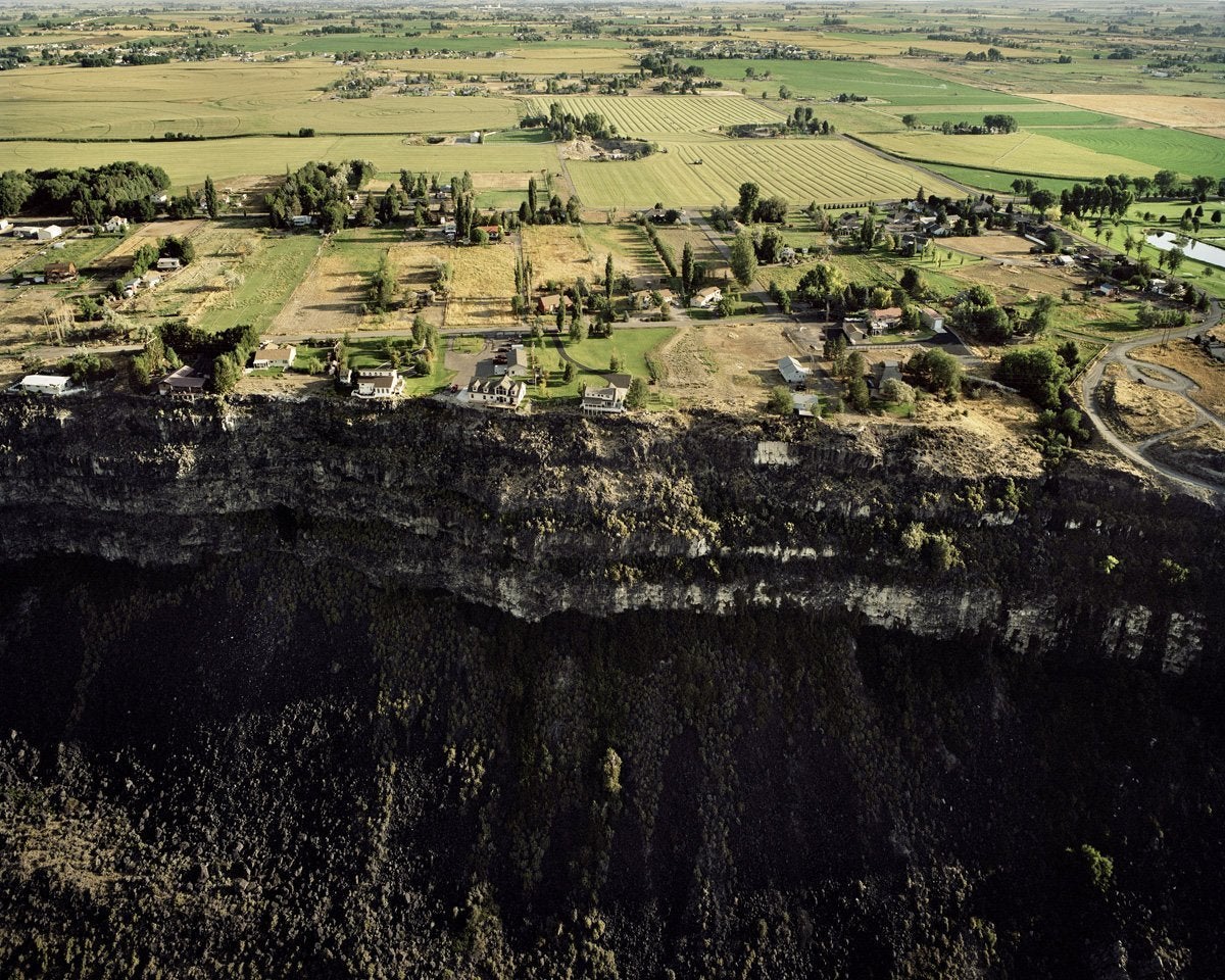 Michael Light Color Photograph - Houses on the Edge of the Snake River Lava Plain, Canyon View Road Looking North, Jerome, ID