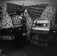 Untitled [Couple Dancing Near Juke Box with Flag and JFK], East 100th St.