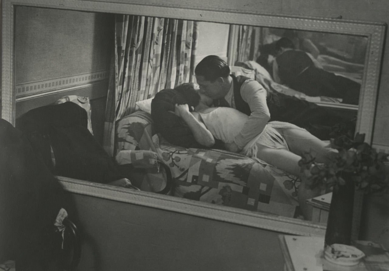 Brassaï Black and White Photograph - Amorous Couple Chez Suzy, Rue Gregoire-de-Tours, 1932