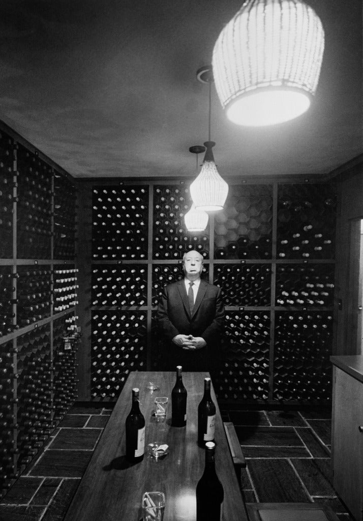 Phil Stern Black and White Photograph - Alfred Hitchcock (In Wine Cellar)