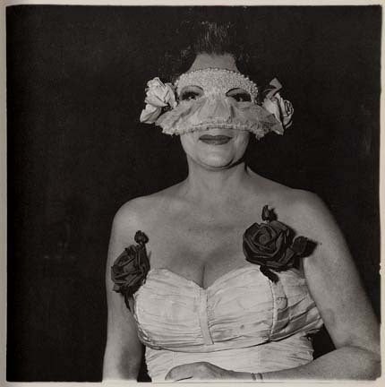 Diane Arbus Portrait Photograph - Lady at a masked ball with two roses on her dress, N.Y.C., 1967