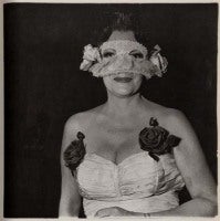 Lady at a masked ball with two roses on her dress, N.Y.C., 1967