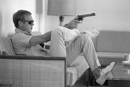 John Dominis Black and White Photograph - Steve McQueen Aims a Pistol, Palm Springs, 1963
