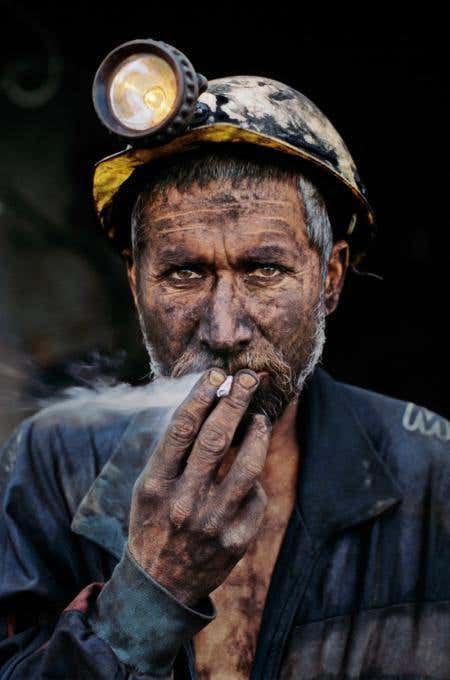 Smoking Coal Miner, Pol-E-Khomri, Afghanistan, 2002 - Steve McCurry