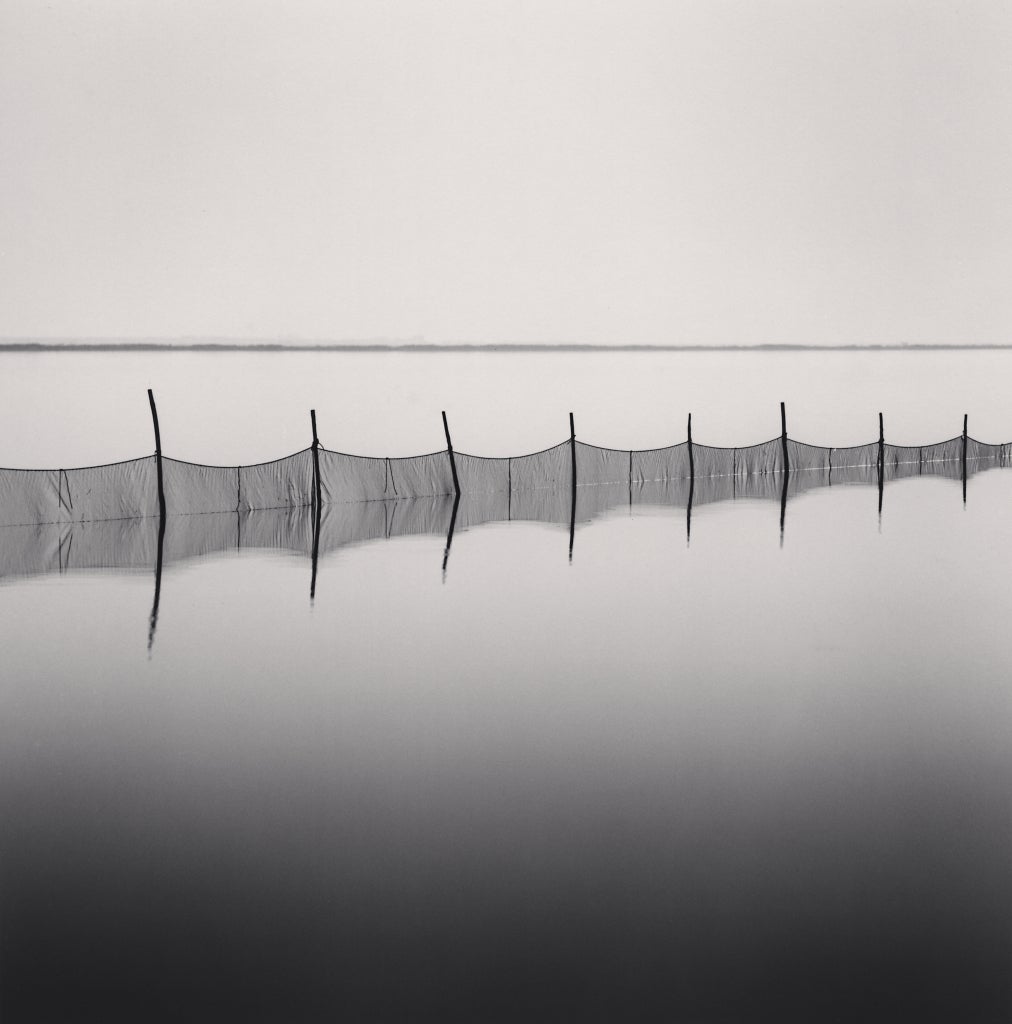 Fishing Nets, Smarlacca, Veneto, Italy, 2006  - Michael Kenna (Black and White)
Signed, dated and numbered 26/45 on mount
Signed, dated, inscribed with title and stamped with photographer's 
Copyright ink stamp on reverse
Sepia toned silver gelatin