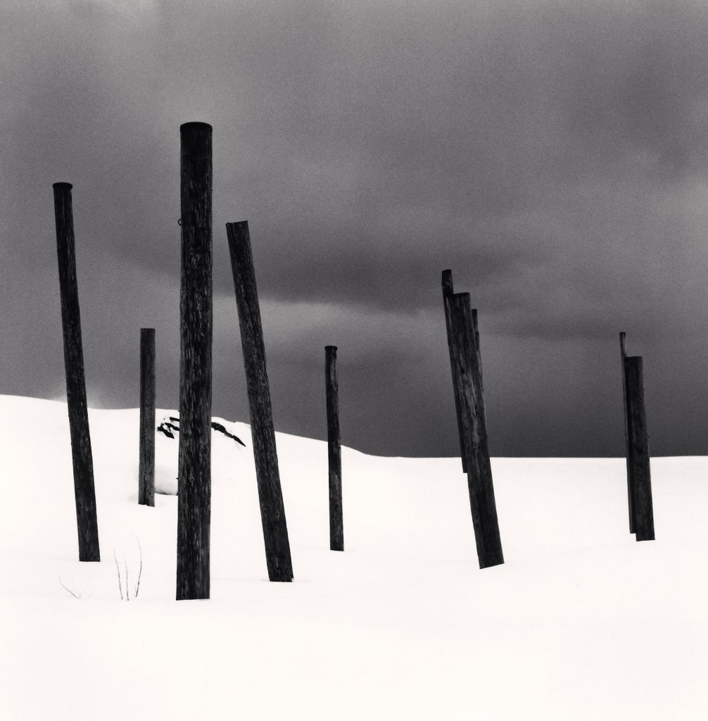 Seven Posts in Snow, Rumoi, Hokkaido, Japan, 2004  - Michael Kenna 
Signed, dated and numbered on mount
Signed, dated, inscribed with title and stamped with photographer's 
Copyright ink stamp on reverse
Sepia toned silver gelatin print, printed