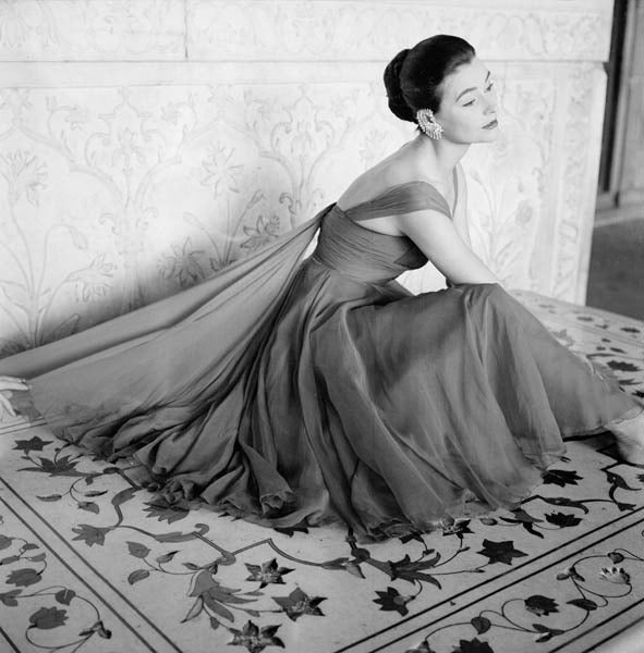 Norman Parkinson Black and White Photograph - Anne Gunning wearing an evening dress in rose red chiffon by Susan Small.