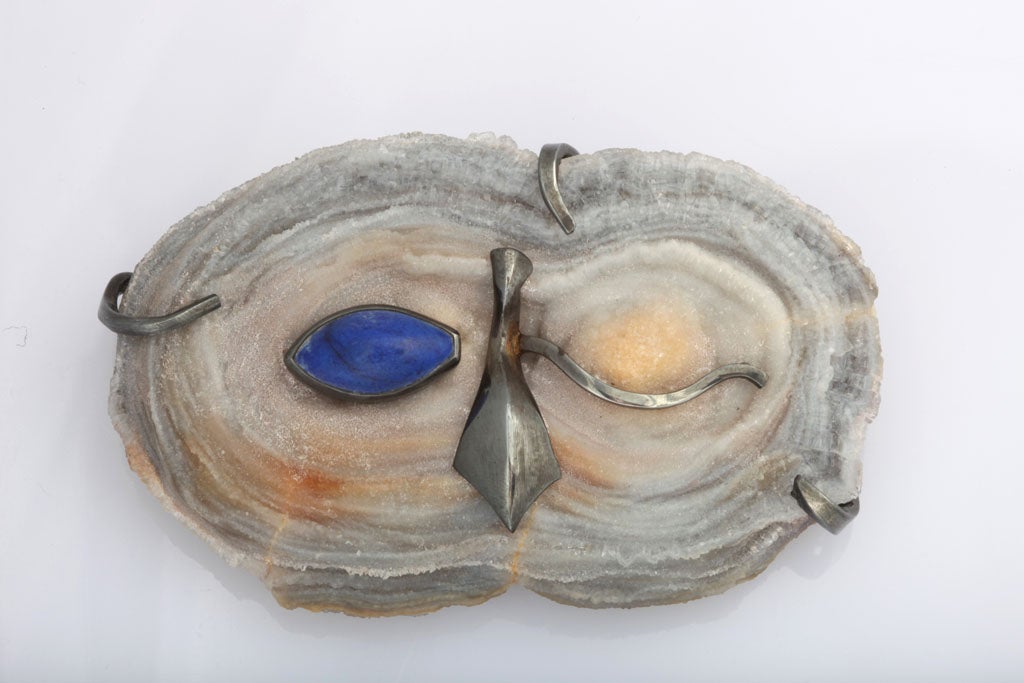 A whimsical piece of jewelry from one of the premiere masters of British jewelry design. Only Andrew Grima can take a piece of agate and turn it into an owl’s slyly winking  visage.