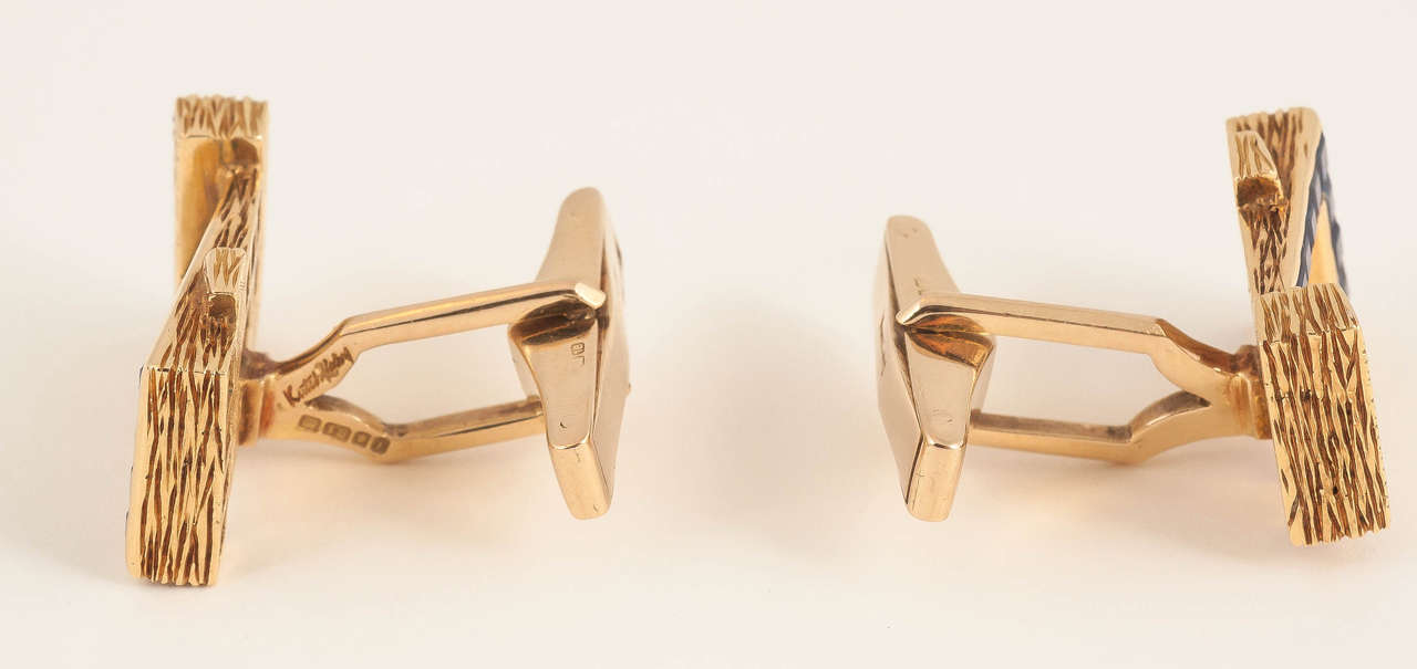 A finely made pair of heavy gold and sapphire cufflinks and matching Tie clip,signed Kutchinsky of london