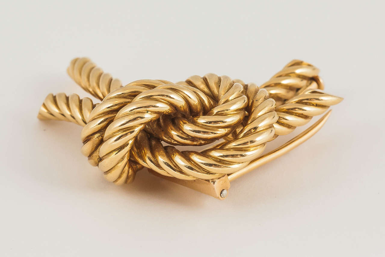 A heavy quality double tied gold knot brooch of rope design in 18ct by Hermes of Paris.c 1950