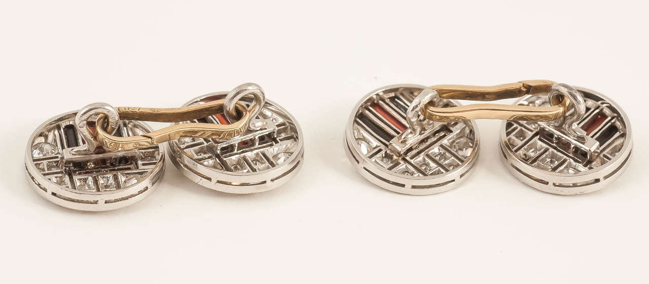 Fine pair of platinum mounted Art Deco cufflinks set with brilliant cut diamonds,coral and onyx ,french c 1930