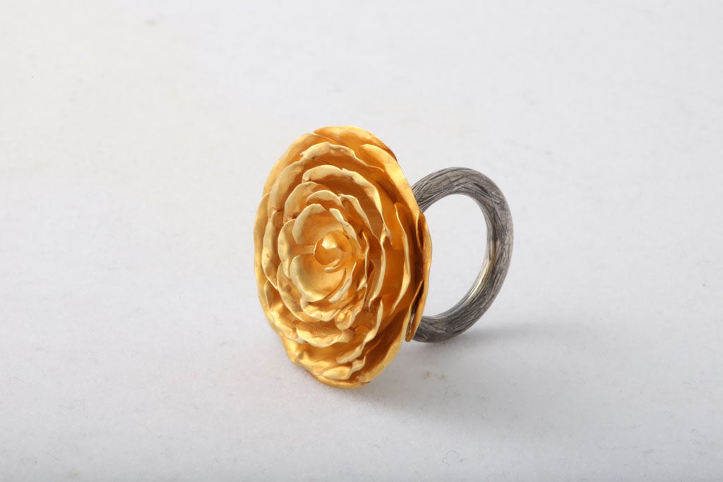 An 18kt yellow gold peony flower ring. The peony is attached to a sterling silver shank/stem.<br />
From the Jaipur Collection Designed by Rebecca Koven