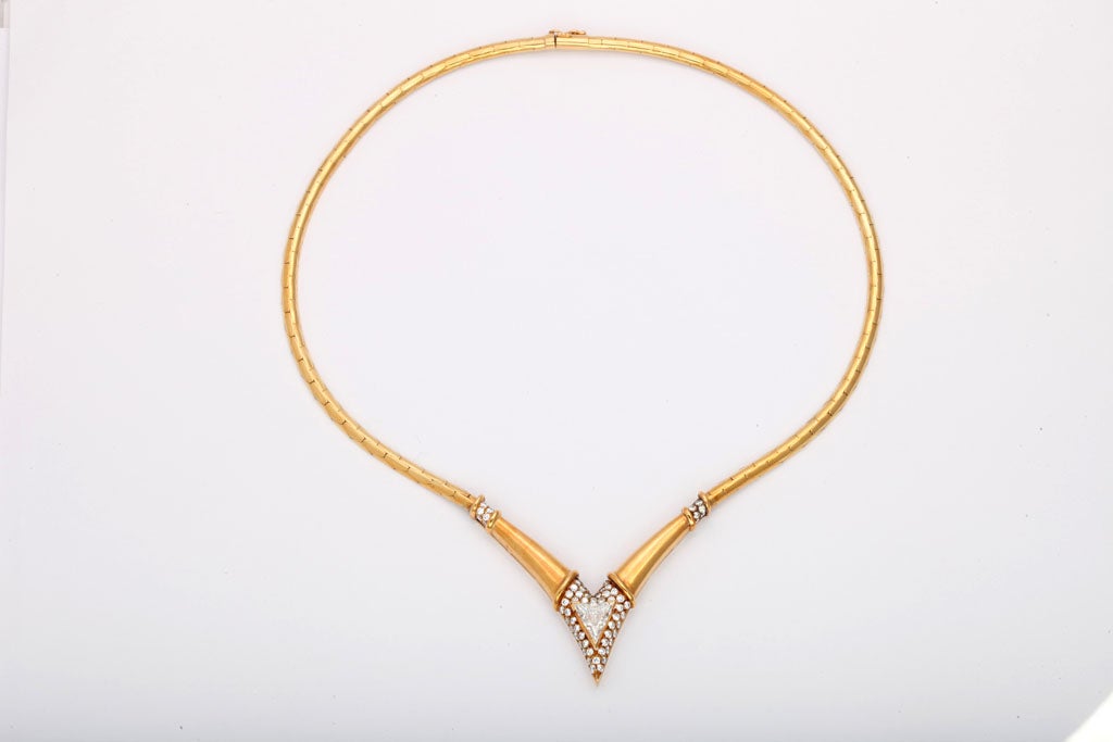 Supple 18kt Yellow Gold Snake chain set with 1.45ct Triangular Diamond - surrounded by full cut round diamonds & separated from the snake chain by a double rows of Diamonds.    Very elegant and retied by Frances Klein of Rodeo Drive in the 1960's.