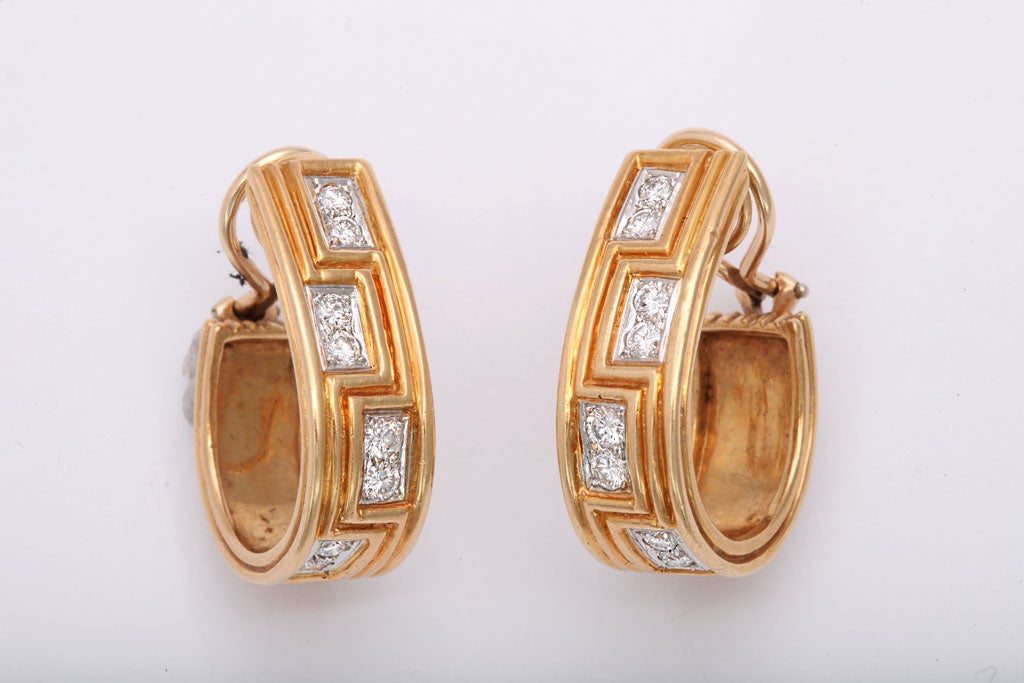 Ultra sophisticated 18kt Yellow Gold Hoop Earrings witha Greek Key Design & set with clean, white, full cut Diamonds.