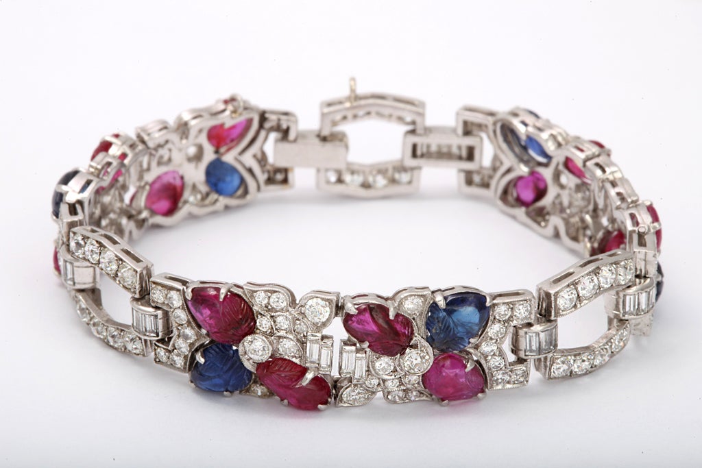 99 round diamonds 5.00 carats
29 baguette diamonds 1.00
6 carved sapphires
12 carved rubies