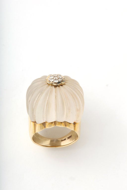 Melon shaped Rock Crystal Ring topped with a Diamond Florette.  Rock Crystal is frosted & segmented to match a fluted Gold Base. Marked 14Kt & 585. Very High style.