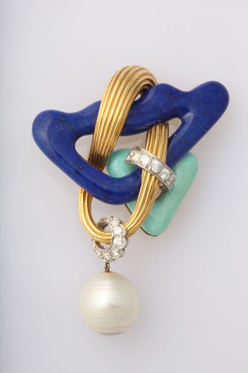 intricately  intertwined, unusual brooch<br />
17 diamonds 1.50<br />
semi baroque south sea cultured pearl 13mm