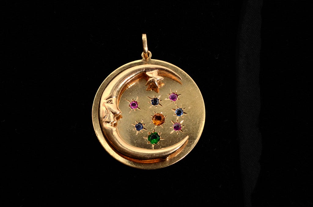 This stunning 14k charm features a relief man on the moon with various multi gem set stars.Nice heavy weight to this beautiful piece. Would make a great addition to a charm bracelet or just great worn on a chain as a pendant.