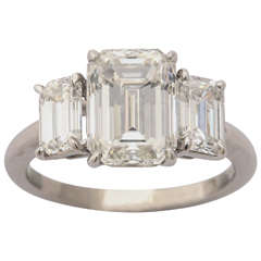 Magnificent Three Stone Emerald Cut Diamond Ring