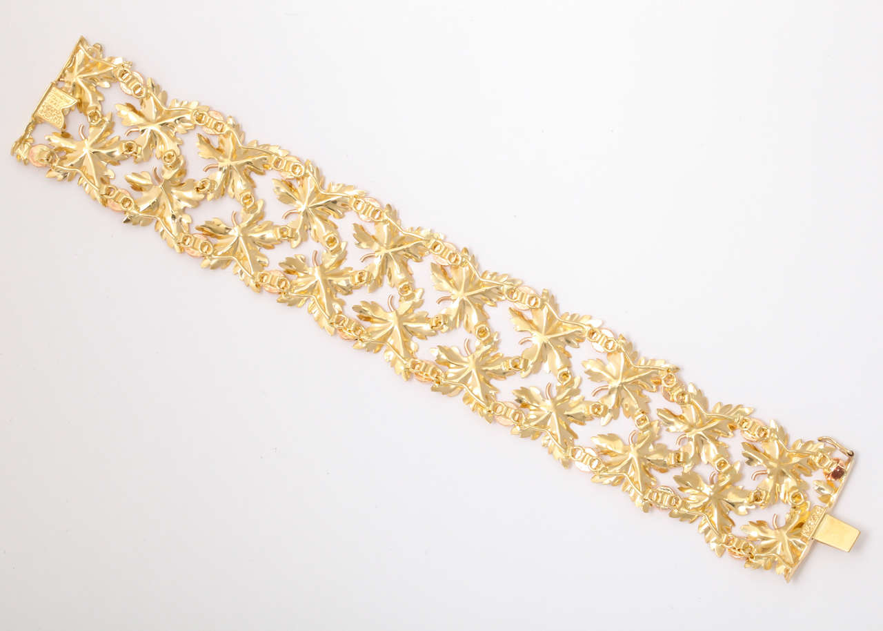 Highly flexible 18k yellow gold and rose gold leaf bracelet. Each leaf is composed of a yellow gold leaf with a rose gold stem separated by rose gold 