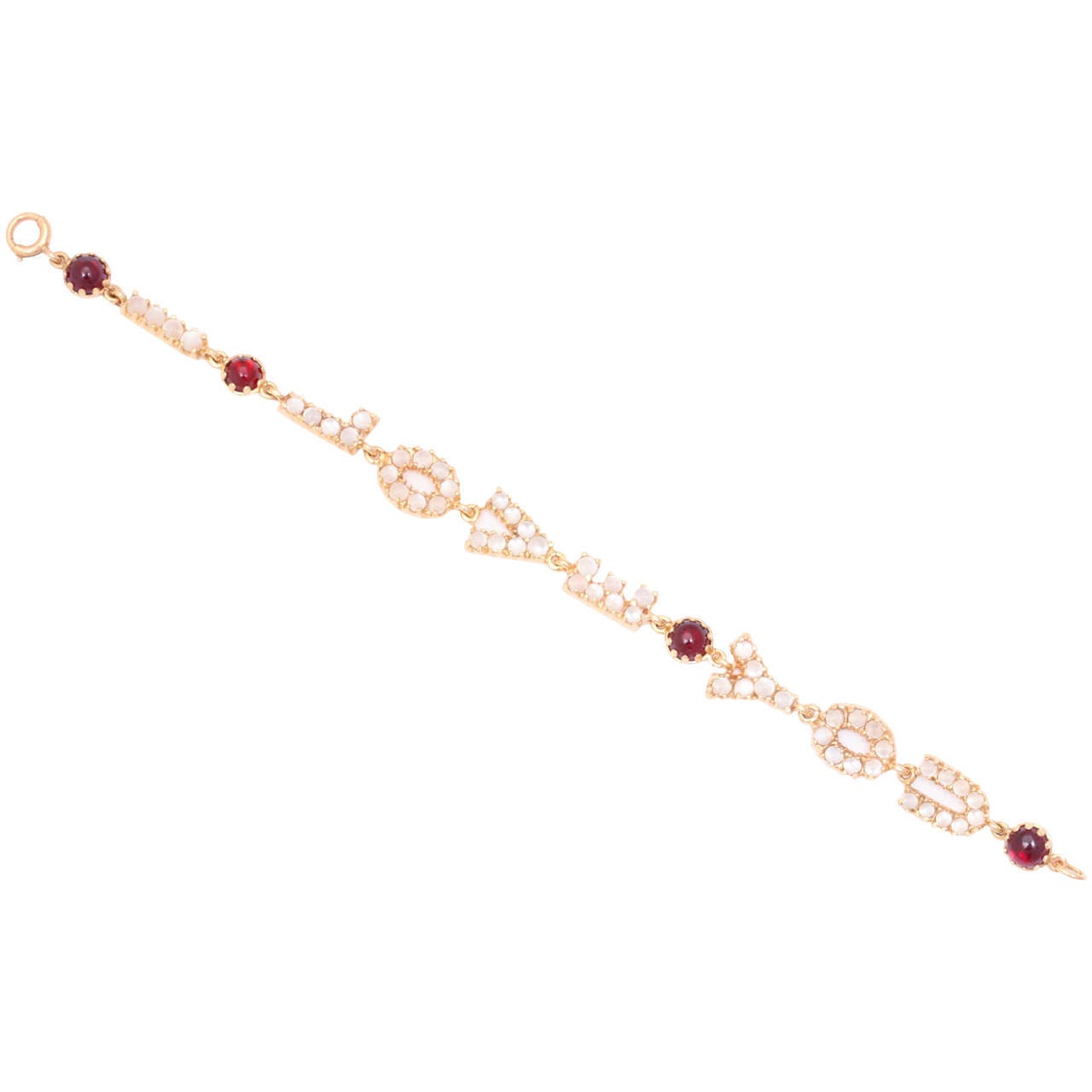 A delicate charm of a bracelet in 14kt gold carries the heart warming words 