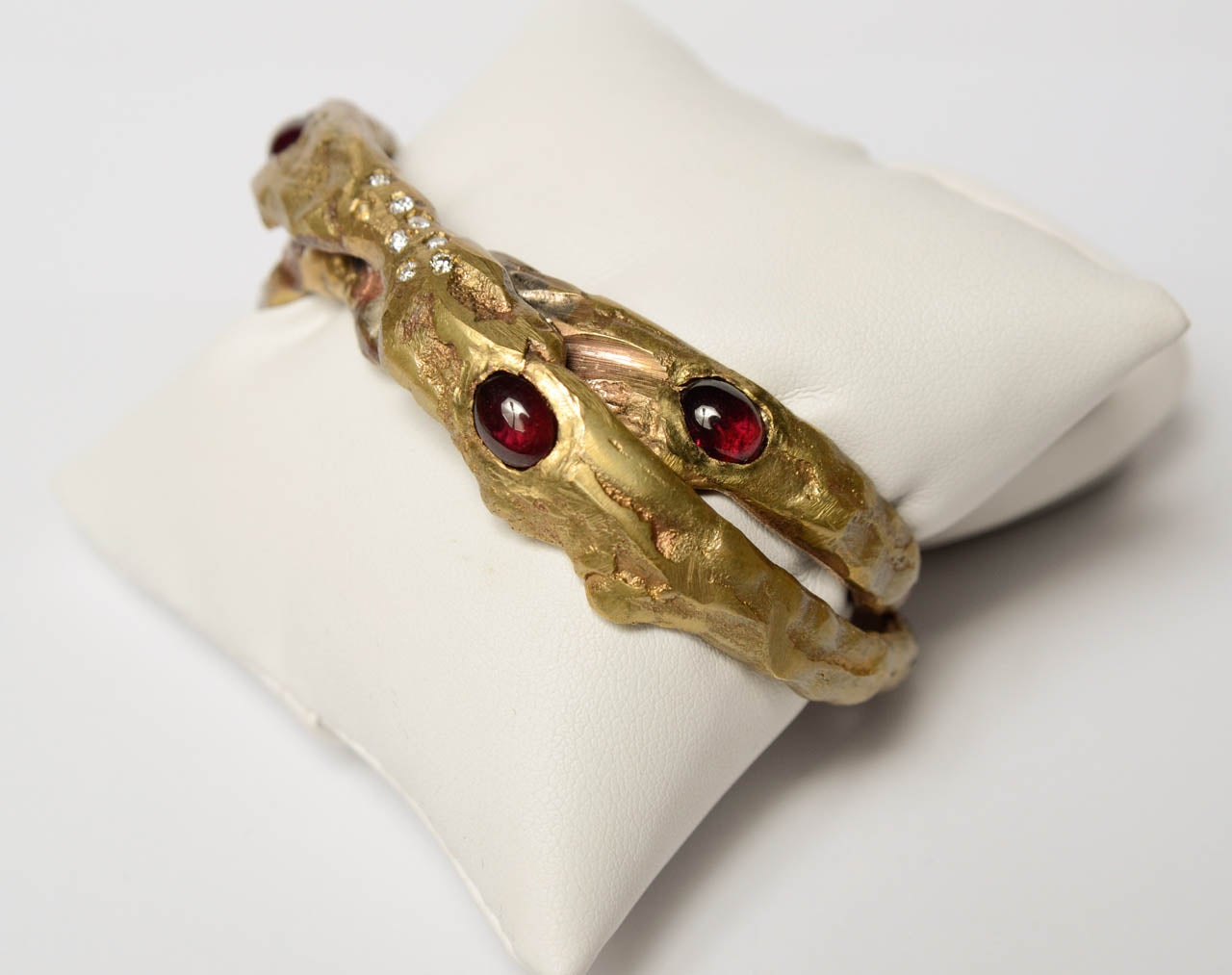 Double golden bronze bracelet with red garnet stones and diamonds