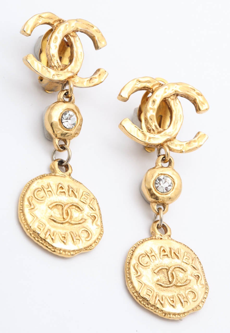 Beautiful Chanel long coin dangling earrings with the iconic CC and rhinestones.