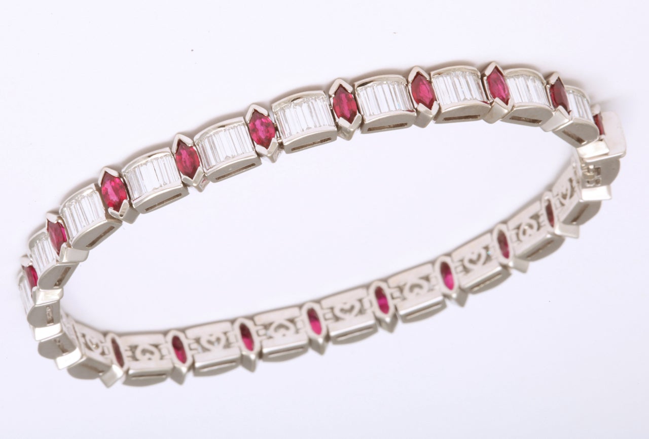 18kt White Gold Diamond Baguette &  marquise shaped Ruby Bracelet.  Marked 18kt & signed KW for Kurt Wayne. Great to mix with Diamond or mixed stone straight line Bracelets.  7.35carats of Diamond Baguettes & 2.5 Faceted Marquise shaped Rubies