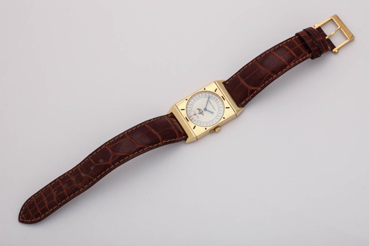 A wonderful Jaeger-LeCoultre 18k yellow gold rectangular wristwatch with date and moonphase function. This is the reissued quartz model of the Art Deco classic. Excellent condition. Reference 400.7.20.  Round dial with outer calendar, moonphase at 6
