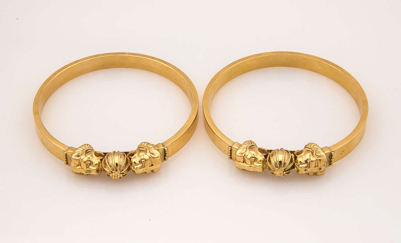 Pair of Antique exceptionally articulated lion and ball motif bracelets, artist signed and marked .  Very unusual and elegant.