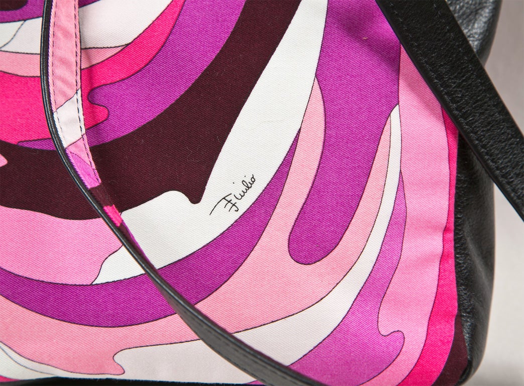 funkyfinders presents this mint signature print pucci crossbody bag. it features cotton blend textile with black leather accents. fittings are silver. the snap closure is signed pucci and 'emilio' is signed in the print several times. the interior