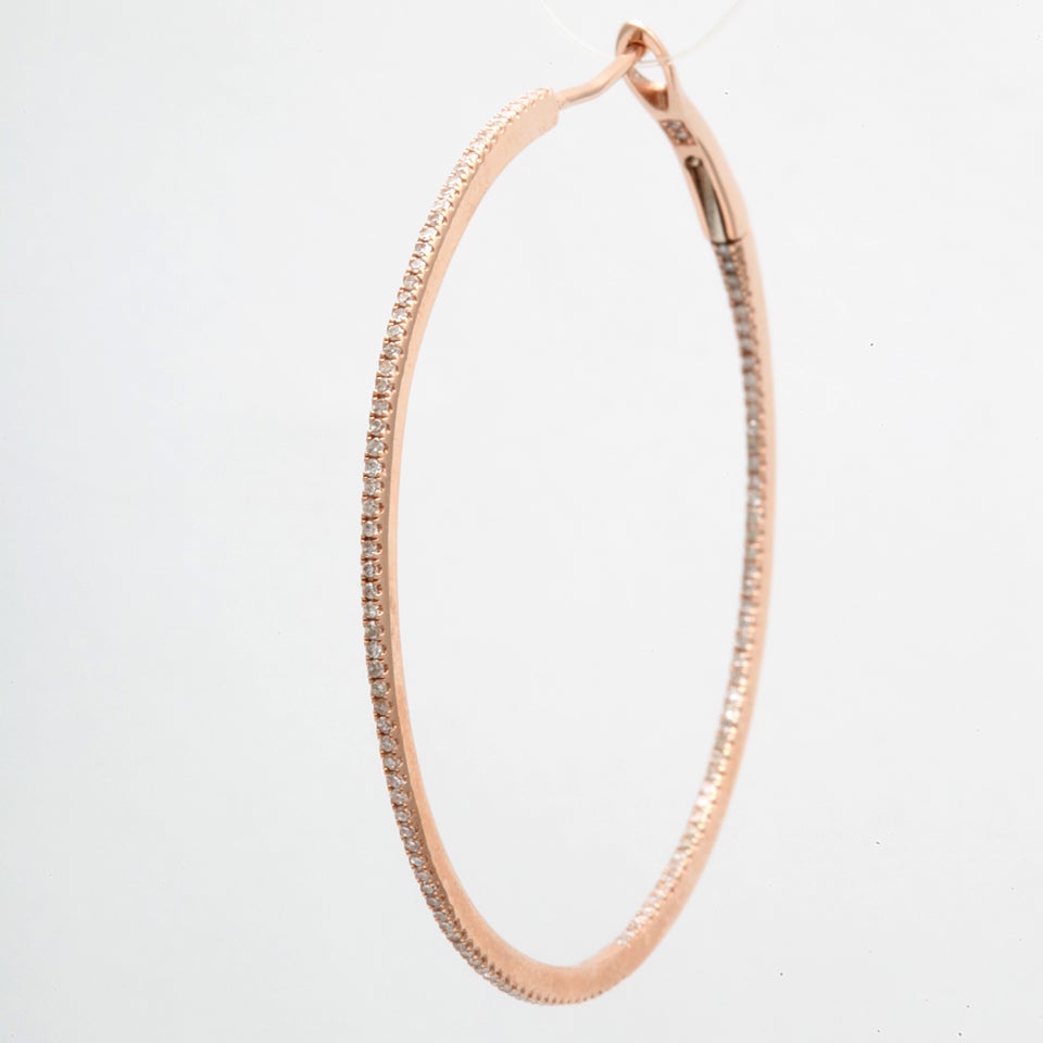 Rose gold diamond hoop earrings weighing 0.65 cts, in 14k  gold.