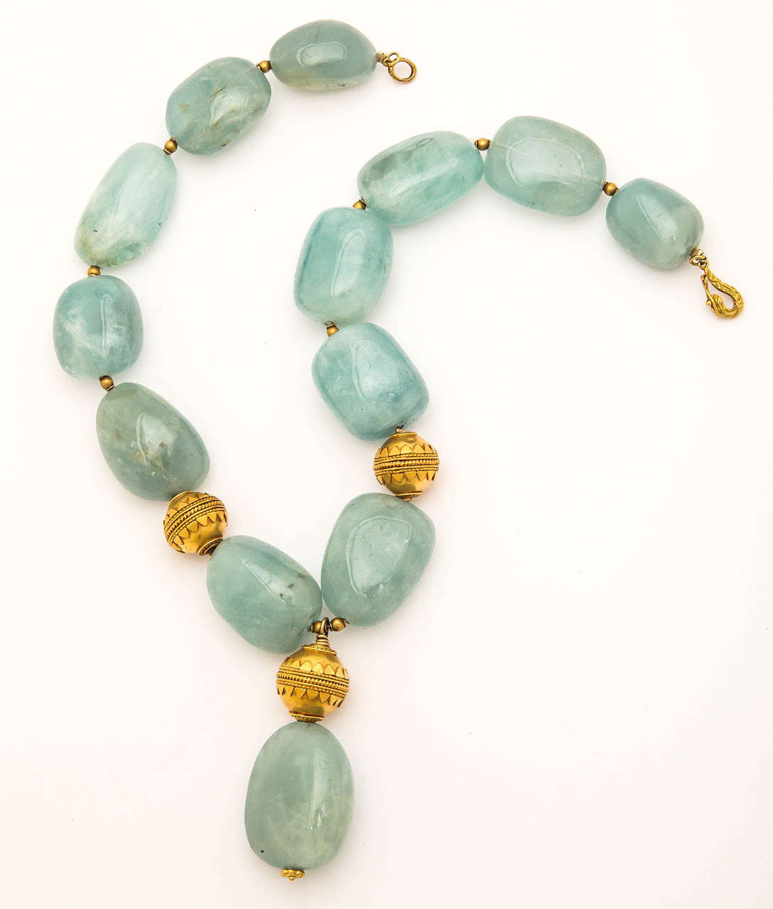 Beautiful , large, smooth aquamarine beads, this size, are rare. The center bead is 1 3/8 in. long.The total length of the necklace is 16 in. and can be lengthened. The gold beads are 18 kt , the largest are 3/4in. in diameter. The clasp is also