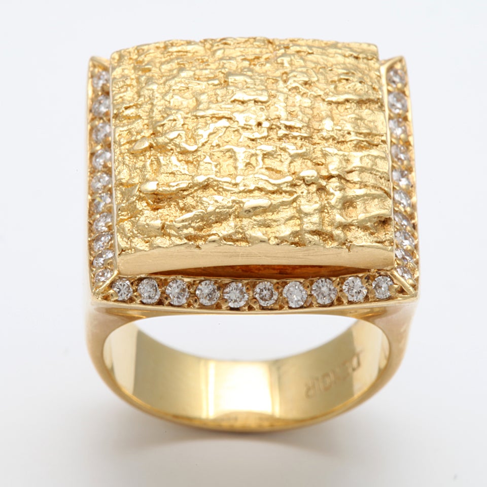 Stunning Textured 18Kt Gold Ring making a huge statement - framed with clean, white, full cut Diamonds.
