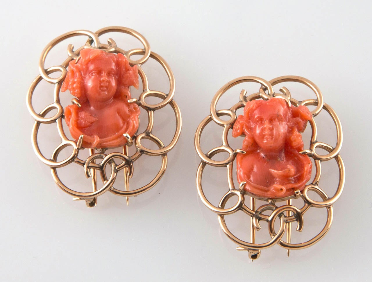 Pair of Raymond Yard Carved Coral Gold Brooches