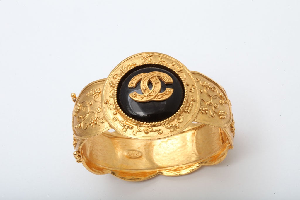 CHANEL BLACK AND GOLD BANGLE BRACELET