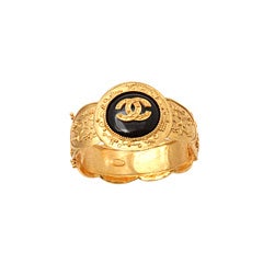 CHANEL BLACK AND GOLD BANGLE BRACELET