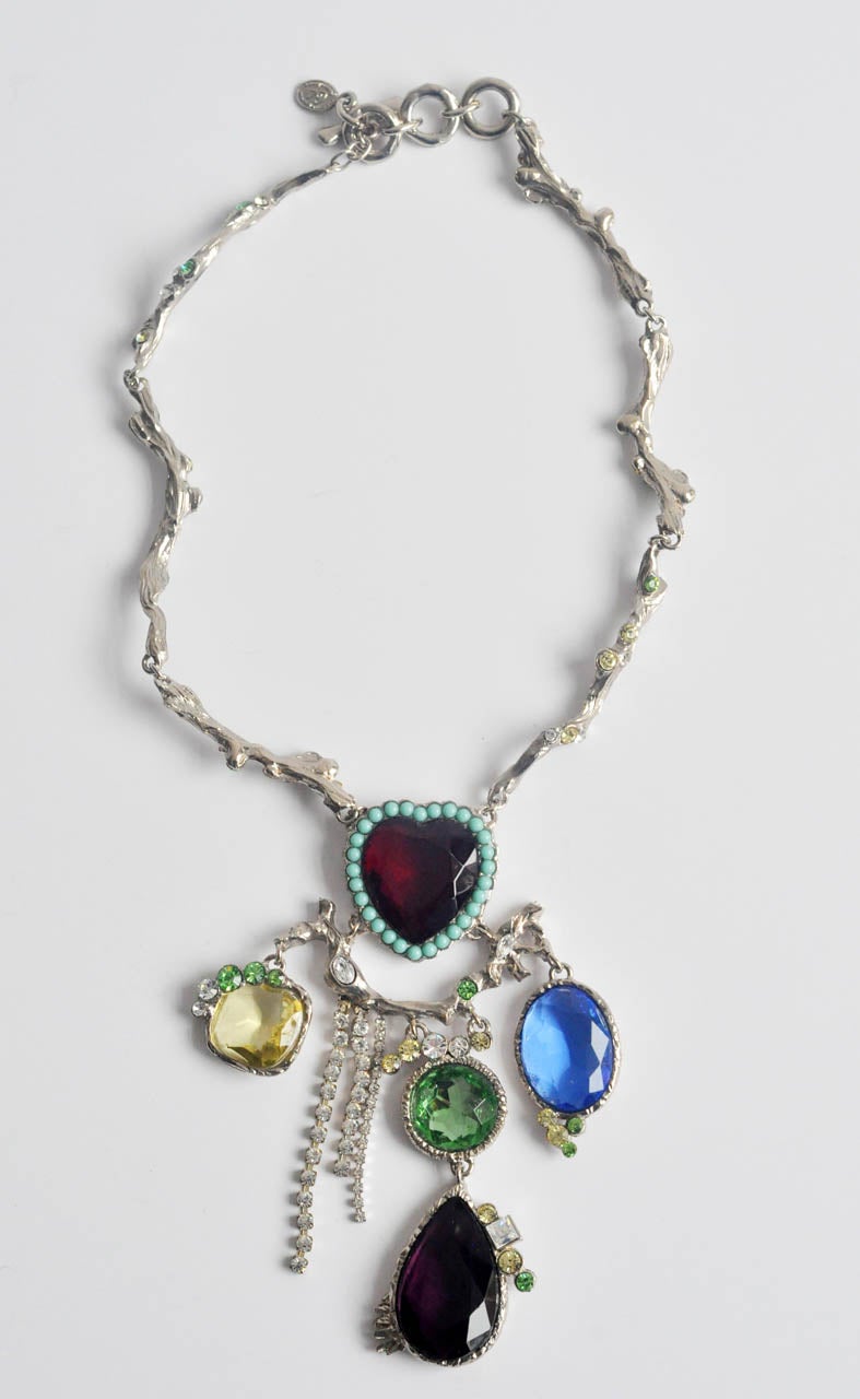 A dazzling, vintage silver-tone necklace by Christian Lacroix.  As is typical of
his best work, Lacroix varies the colors, shapes and materials to create his highly original designs.  This avant-garde necklace combines heart-shaped, oval and