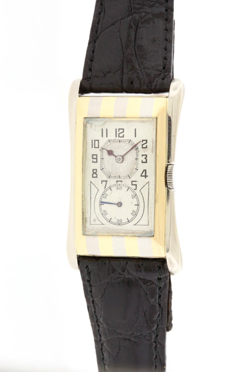 Rare 18k yellow and white gold striped Rolex Prince Brancard wristwatch, circa 1930. The iconic 'doctor's watch' with its elongated flared 26mm x 43mm case, two-tone matte silvered dial with painted Arabic numerals, octagonal upper minute track,